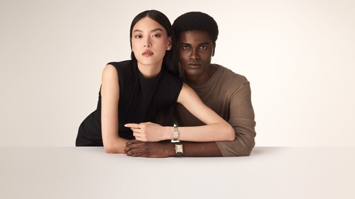 Models wearing iconic timepieces, showcasing the best Cartier watch designs in a minimalist studio setting.