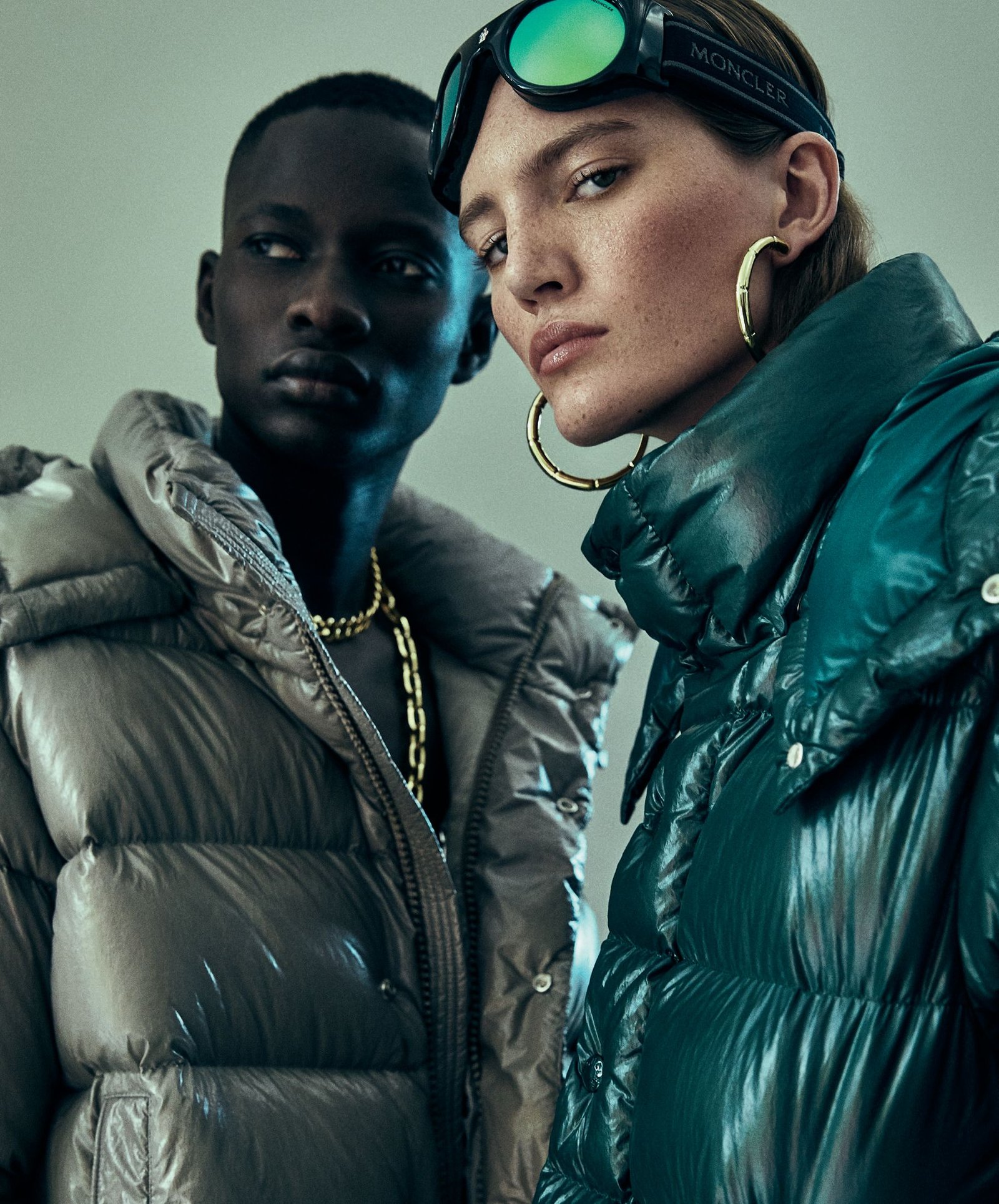 Model wearing a colourful Moncler Maya 70 down jacket in an anniversary campaign.