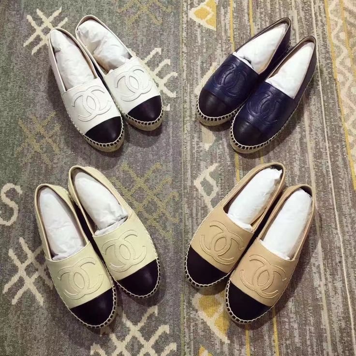 A collection of Chanel espadrilles in several neutral colours and materials.