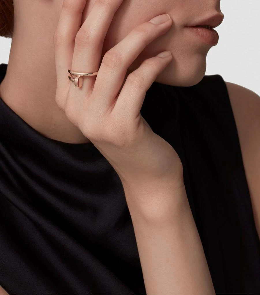 Model wearing a yellow-gold Cartier Juste un Clou ring on her hand.