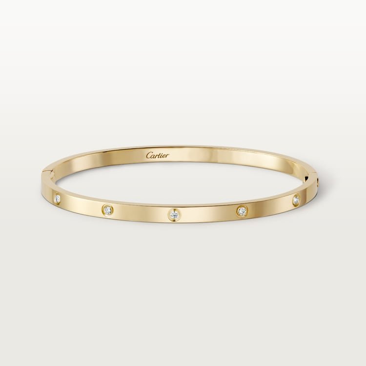 Small yellow-gold Cartier Love Bracelet set with diamonds.
