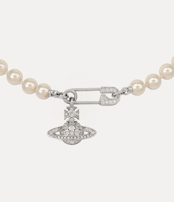 Close-up of Vivienne Westwood Orb and pearl necklace details