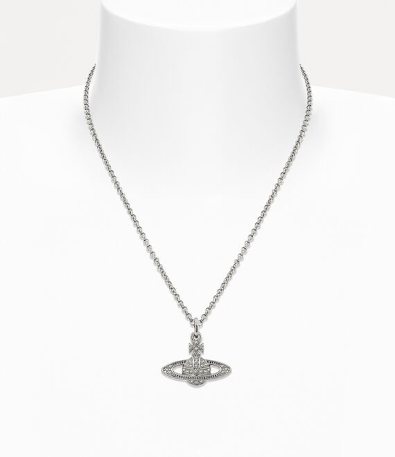 Model wearing a Vivienne Westwood Orb pendant with tailored clothing
