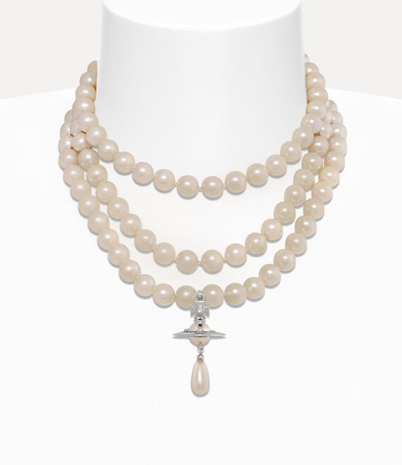 Model wearing a three-row Vivienne Westwood pearl necklace