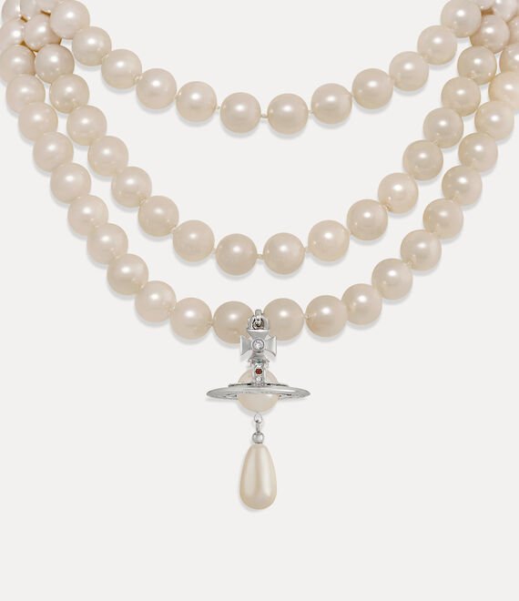 Close-up of a layered Vivienne Westwood pearl necklace with Orb detailing