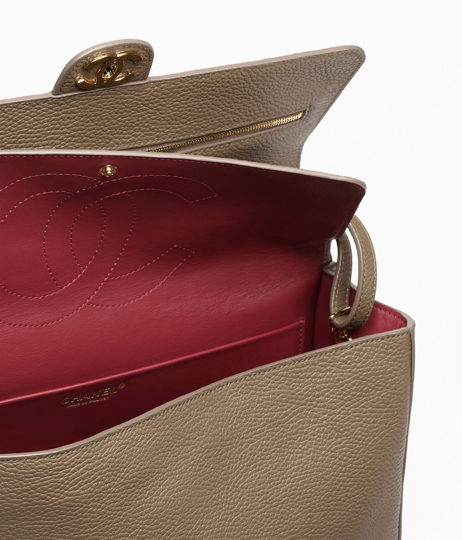 Dark khaki Chanel Maxi Flap Bag showing the leather and flap construction