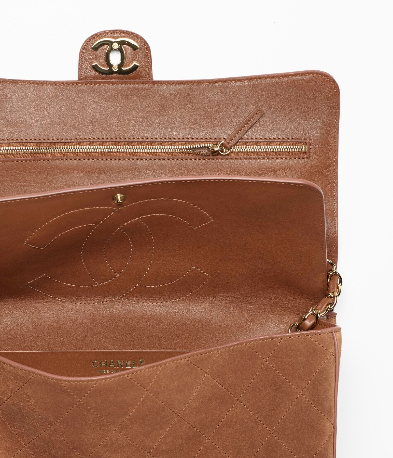 Camel suede Chanel Maxi Flap Bag shown in profile