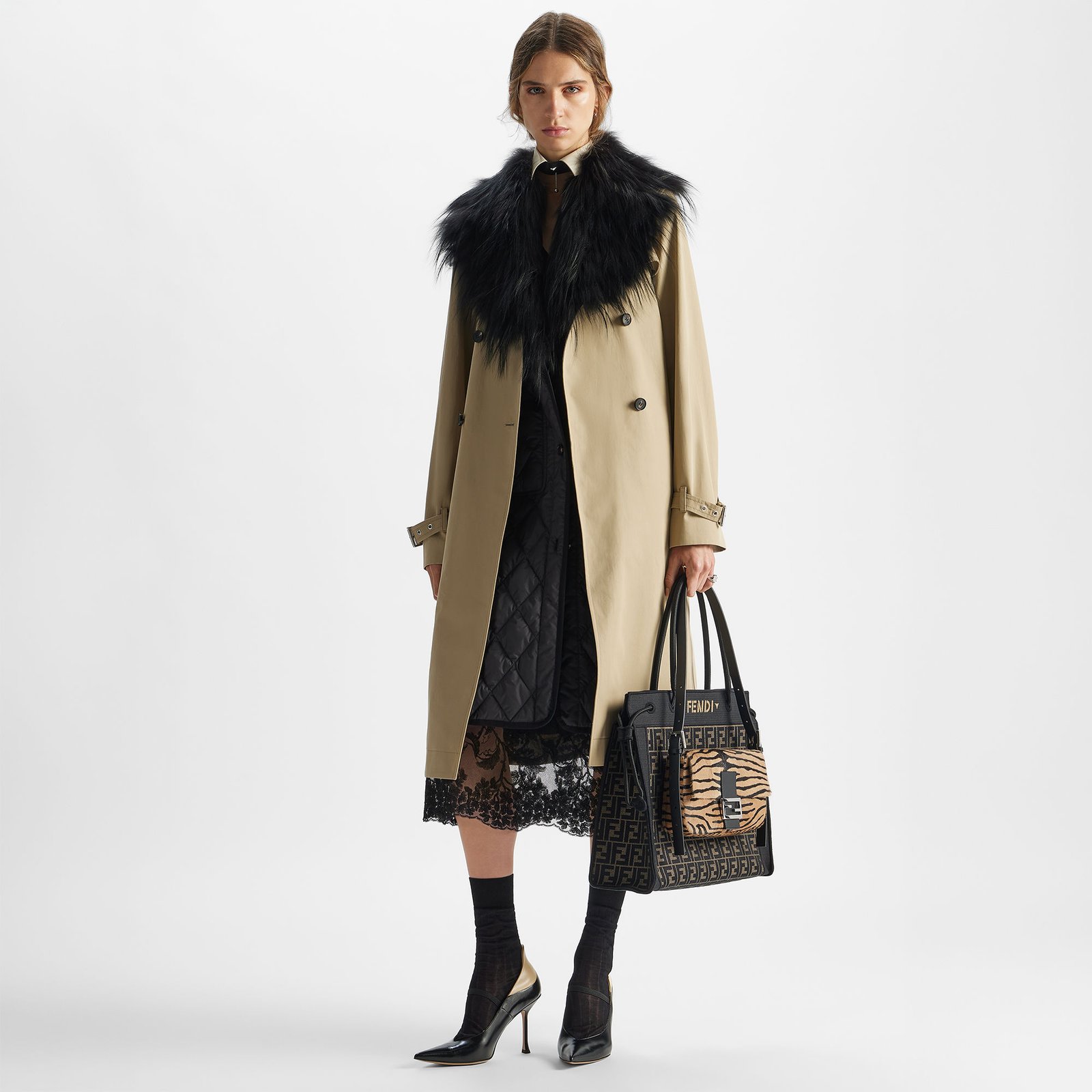 Model styling the brown FF Fendi Magic Shopper with a neutral coat.