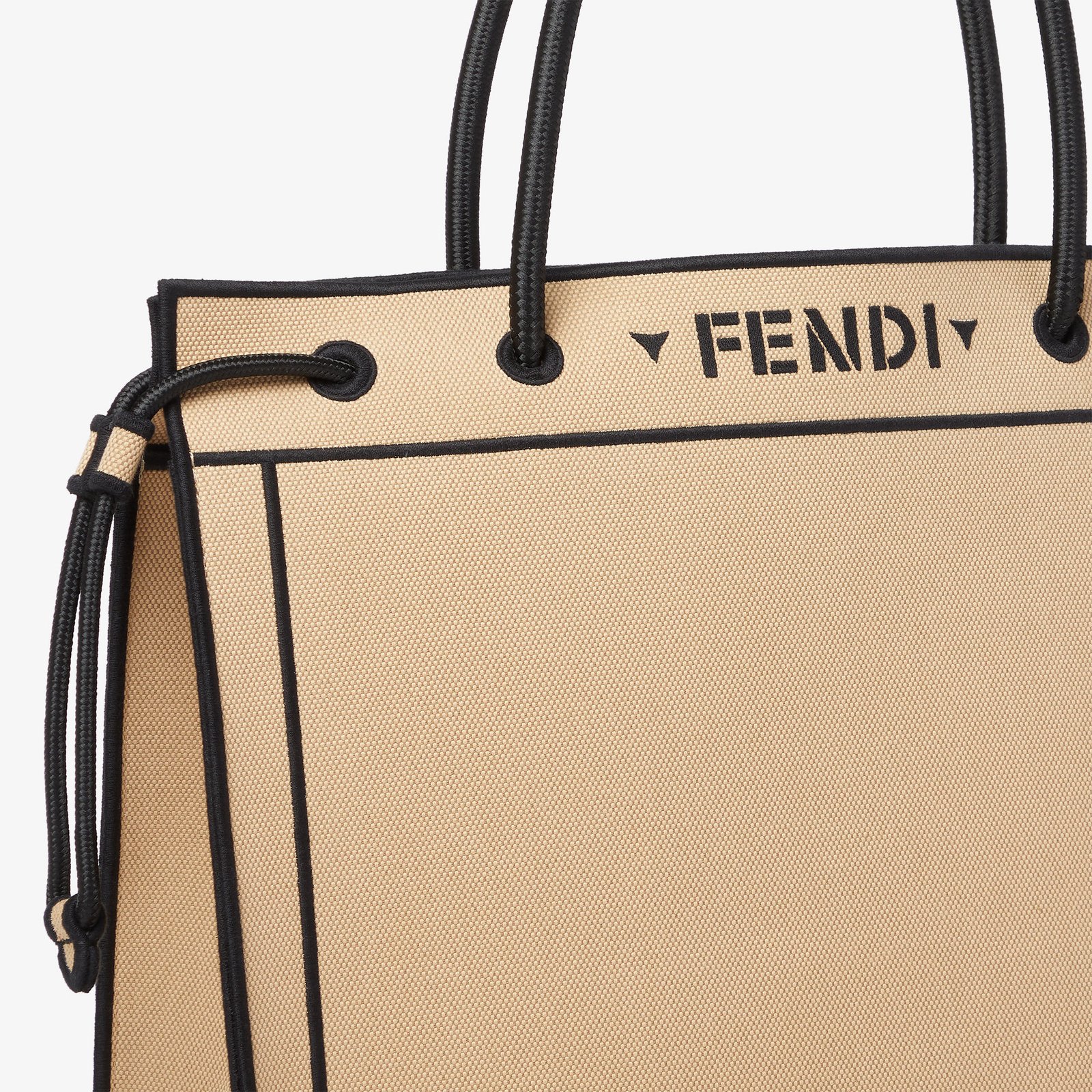 Close-up of the beige Fendi Magic Shopper cord handle and side drawstring.