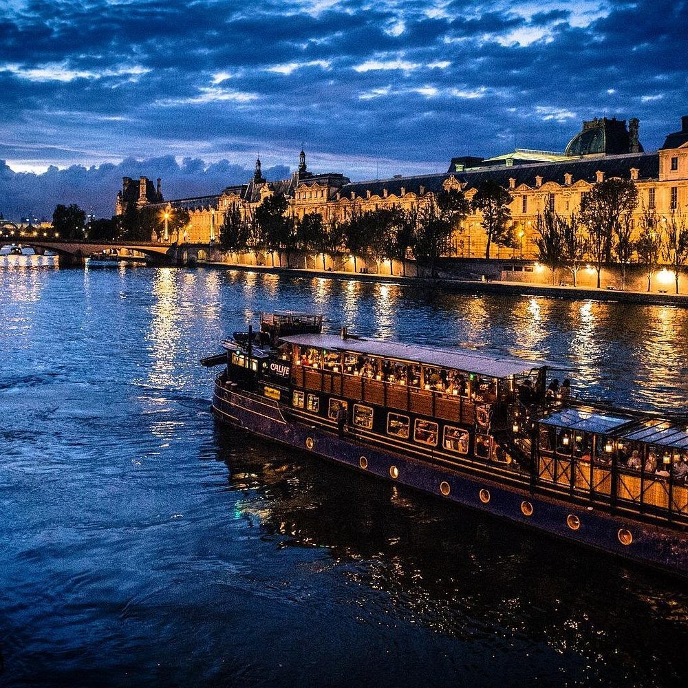 Illuminated Paris street at night