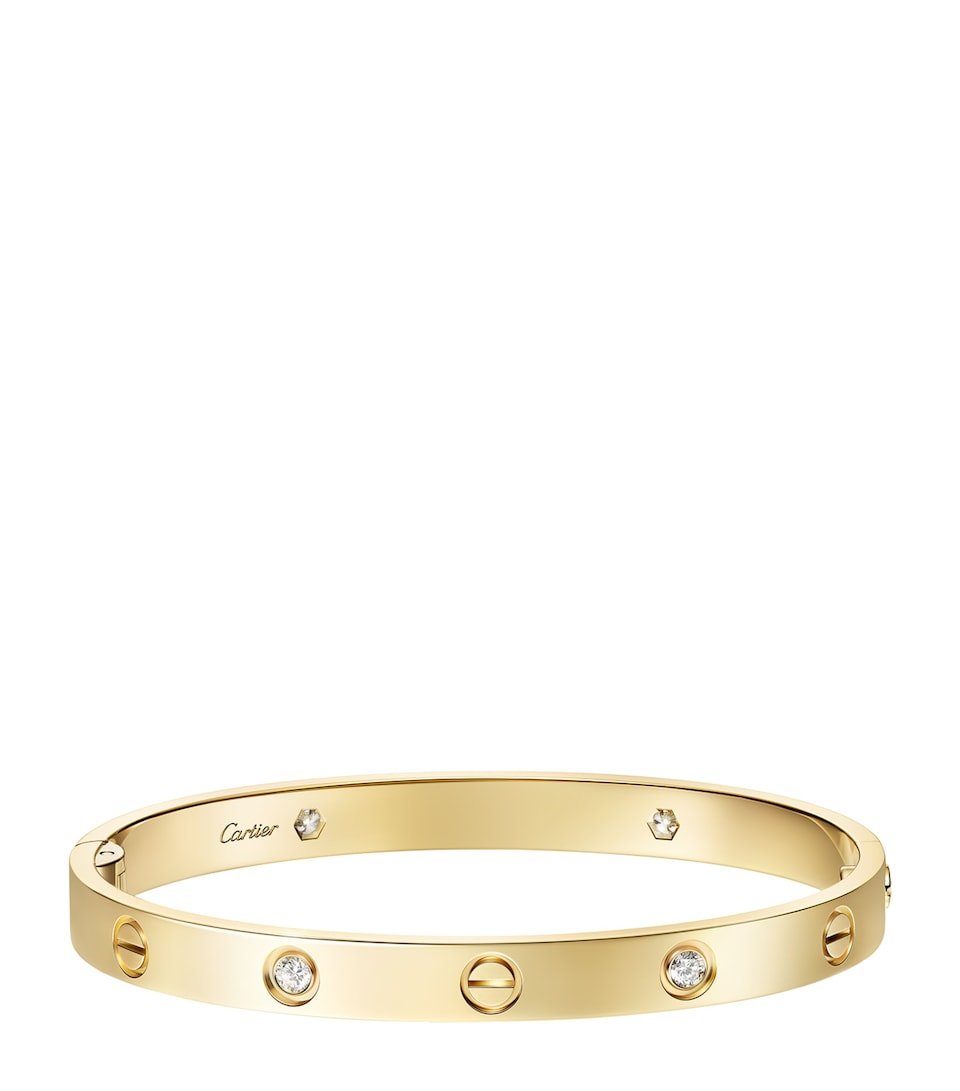 Four-diamond Cartier Love Bracelet in yellow gold.