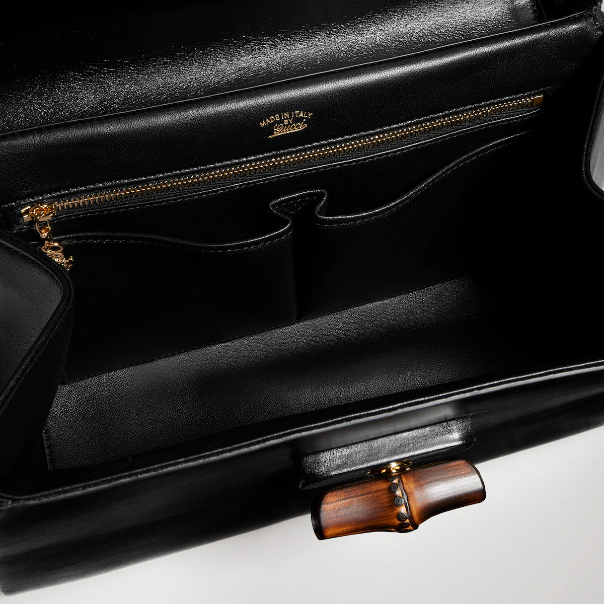 Open Gucci Bamboo Vendetta with zipped and open interior pockets.