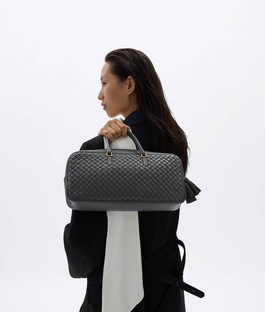 Bottega Veneta Small Elio in Obsidian Gray showing its slim rectangular body