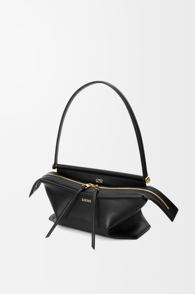 Black Loewe Whisker Bag arranged with its detachable strap for styling