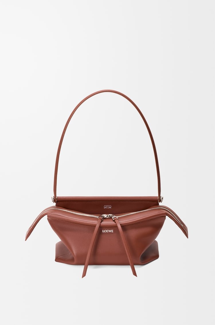 Cognac Loewe Small Whisker Bag in glazed calfskin on a clean background