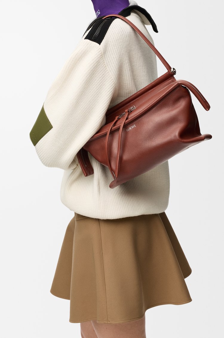 Cognac Loewe Small Whisker Bag highlighting its glazed calfskin construction