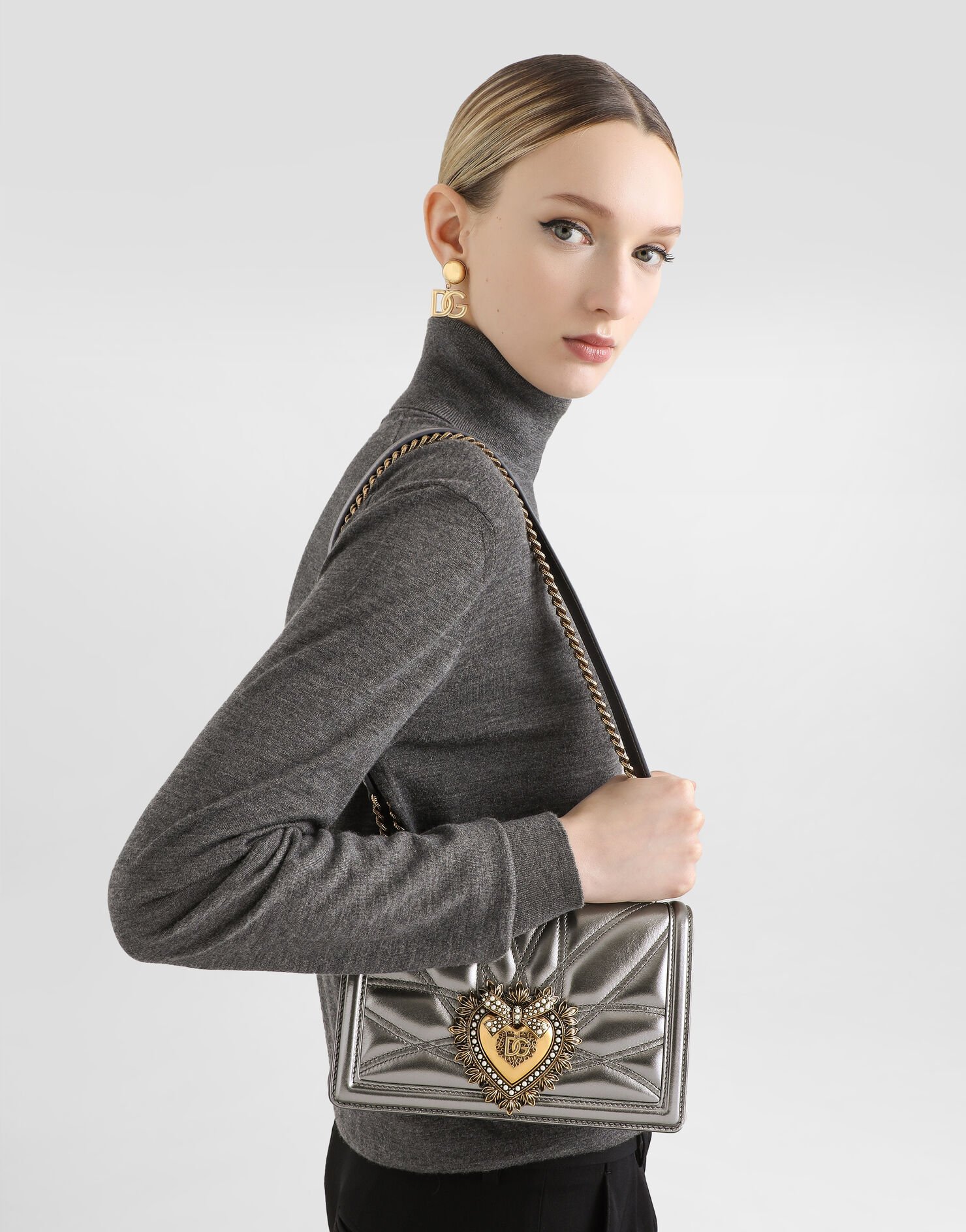 Model wearing a silver Dolce & Gabbana medium Devotion shoulder bag.