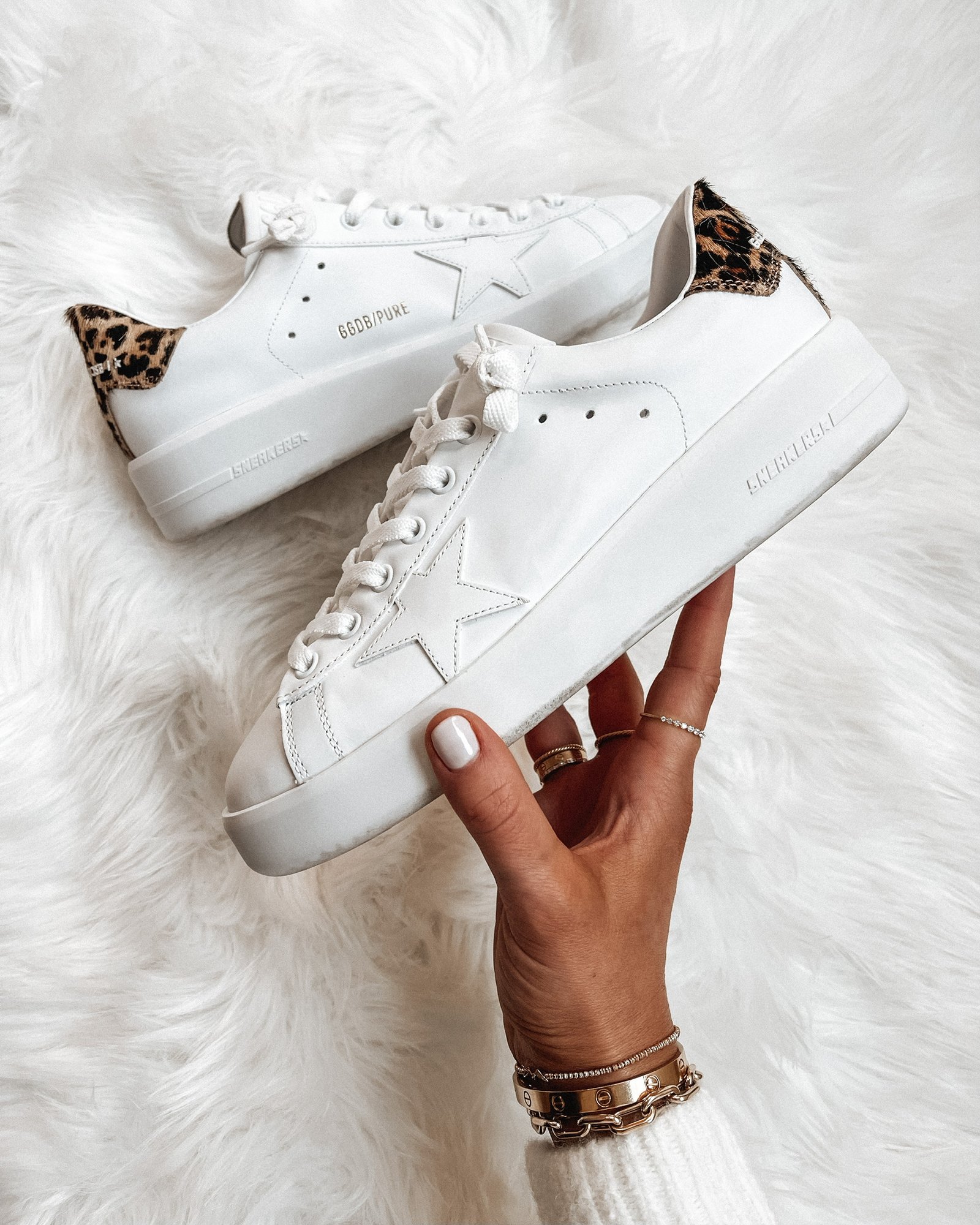 Close-up of Golden Goose sneakers combining smooth leather and leopard-print panels