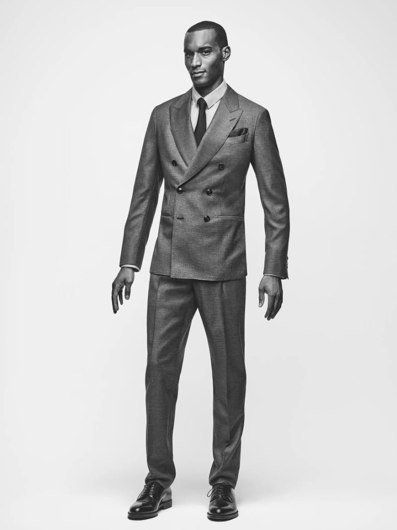 Model wearing a grey Giorgio Armani double-breasted suit.