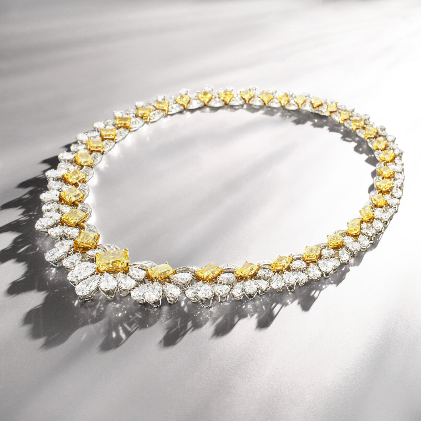 Graff diamond necklace featuring mixed diamond cuts and yellow accents.