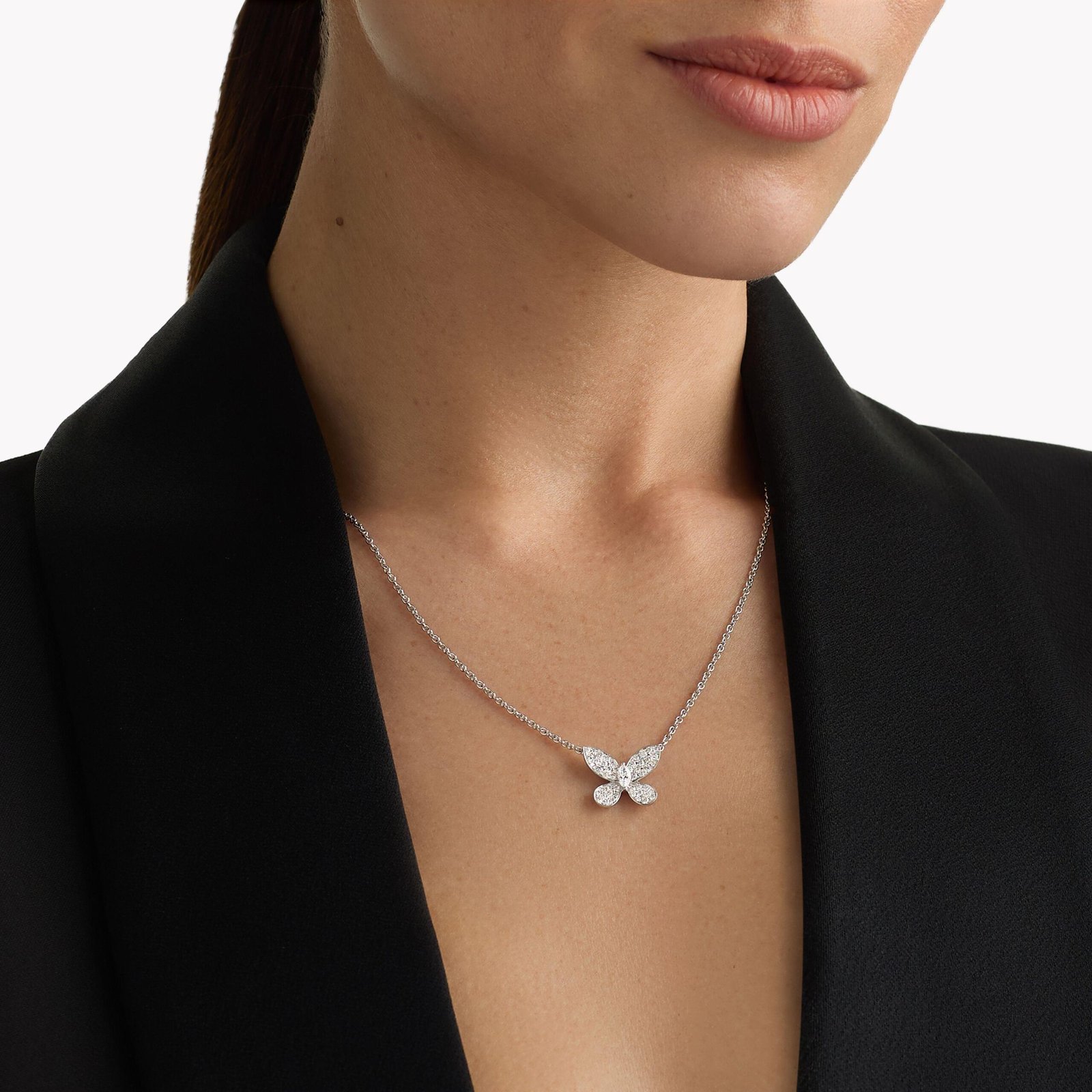 Model wearing a Graff Butterfly diamond pendant.