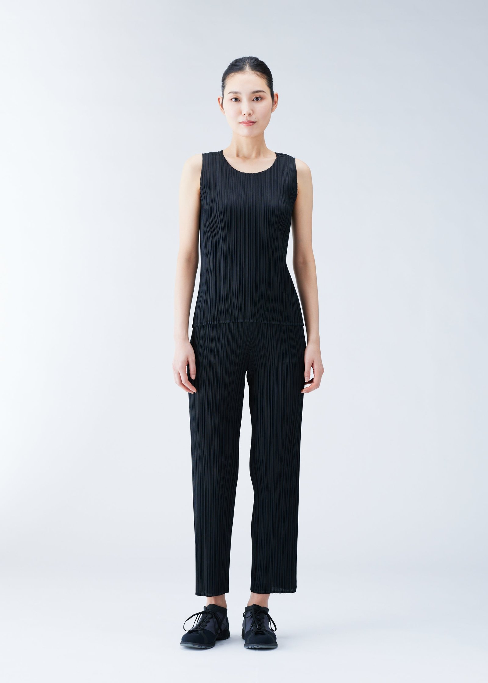 Pleats Please Issey Miyake clothing worn on a model to show proportion and fit