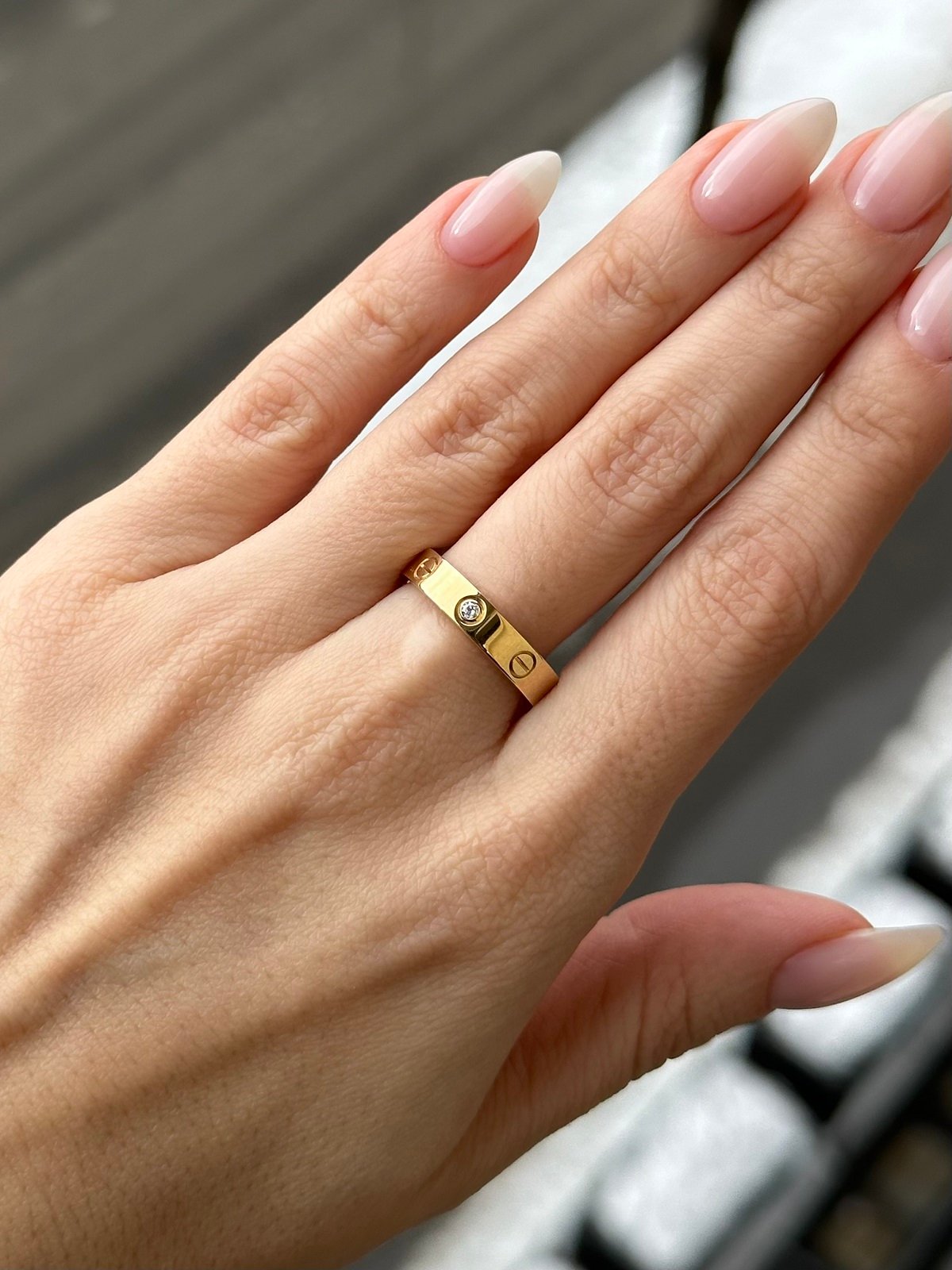 Cartier LOVE ring in yellow gold with one brilliant-cut diamond.