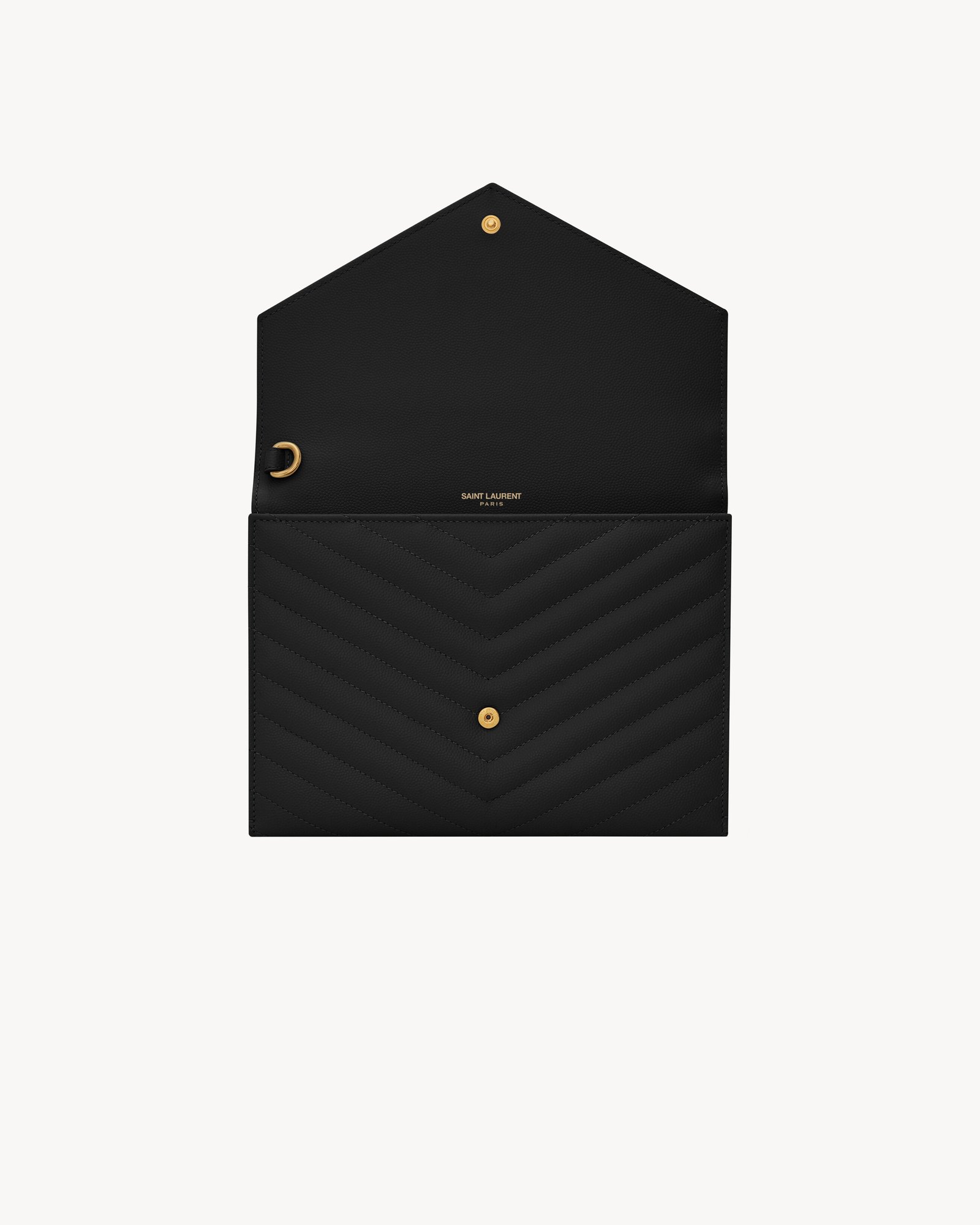 Open black Saint Laurent Cassandre Clutch showing its snap closure and main compartment.