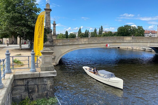 Electrified vintage 1920s boat cruising through Berlin
