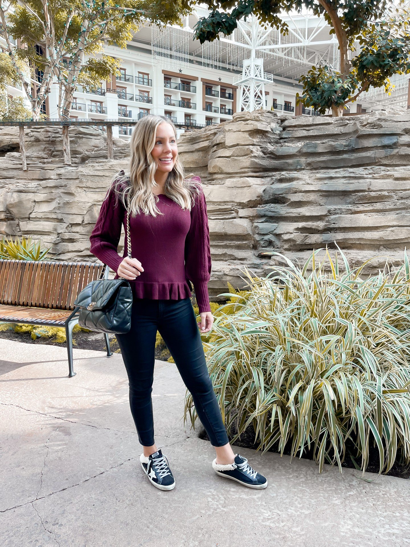 Golden Goose sneakers styled with relaxed denim and neutral layers