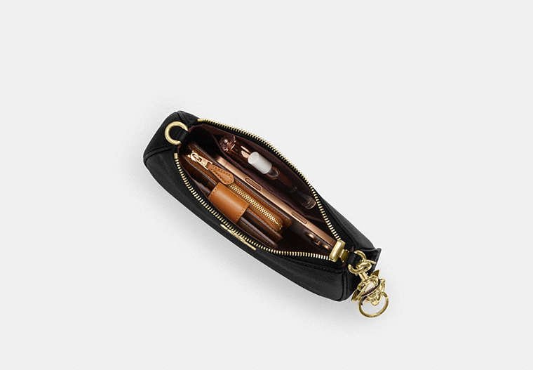 Coach Teri Shoulder Bag shown from an angle to reveal its compact depth.