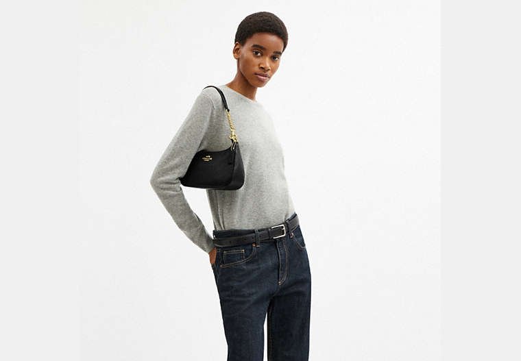 Black Coach Teri Bag shown with its detachable shoulder and crossbody straps.