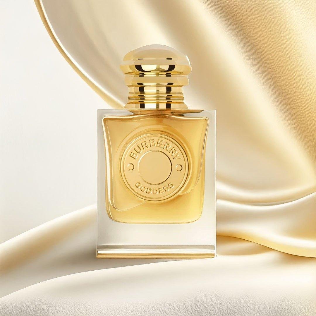 Burberry Goddess Eau de Parfum bottle displayed on softly draped gold fabric.