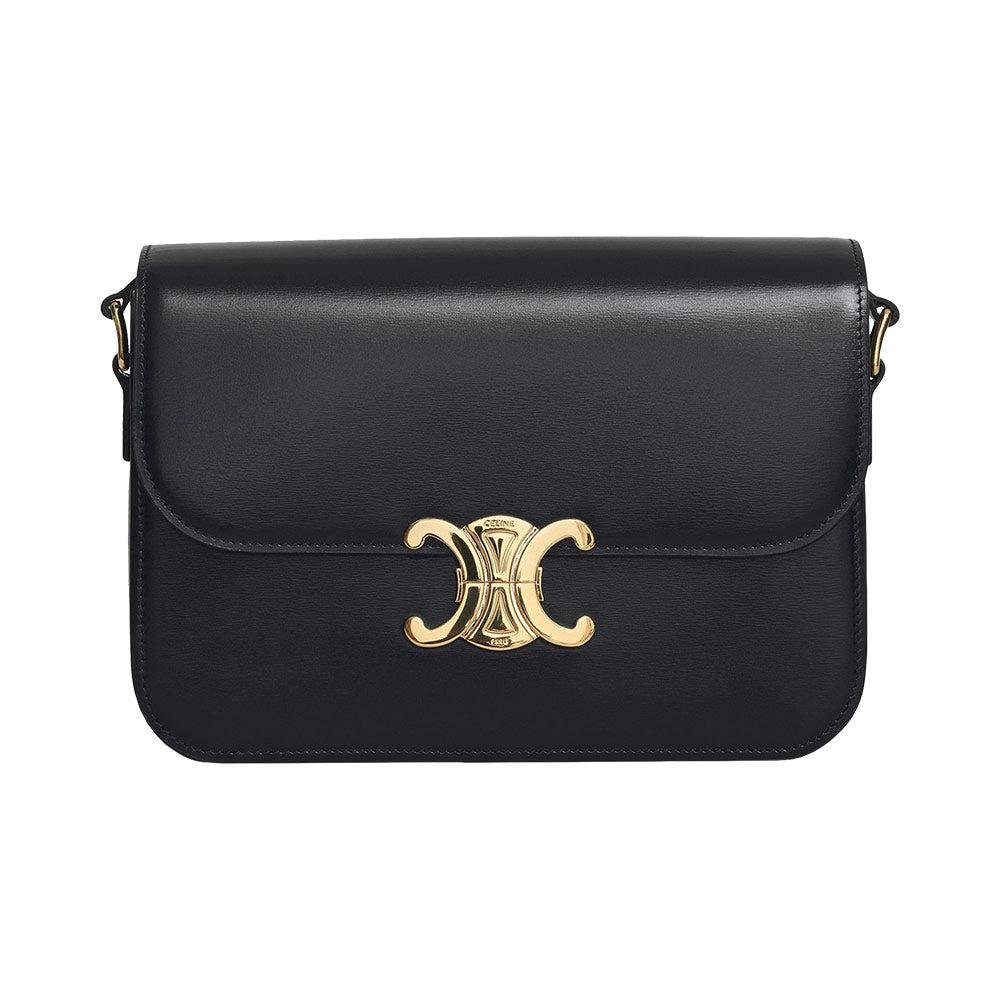 Black Celine Classique Triomphe bag photographed in a Parisian interior.