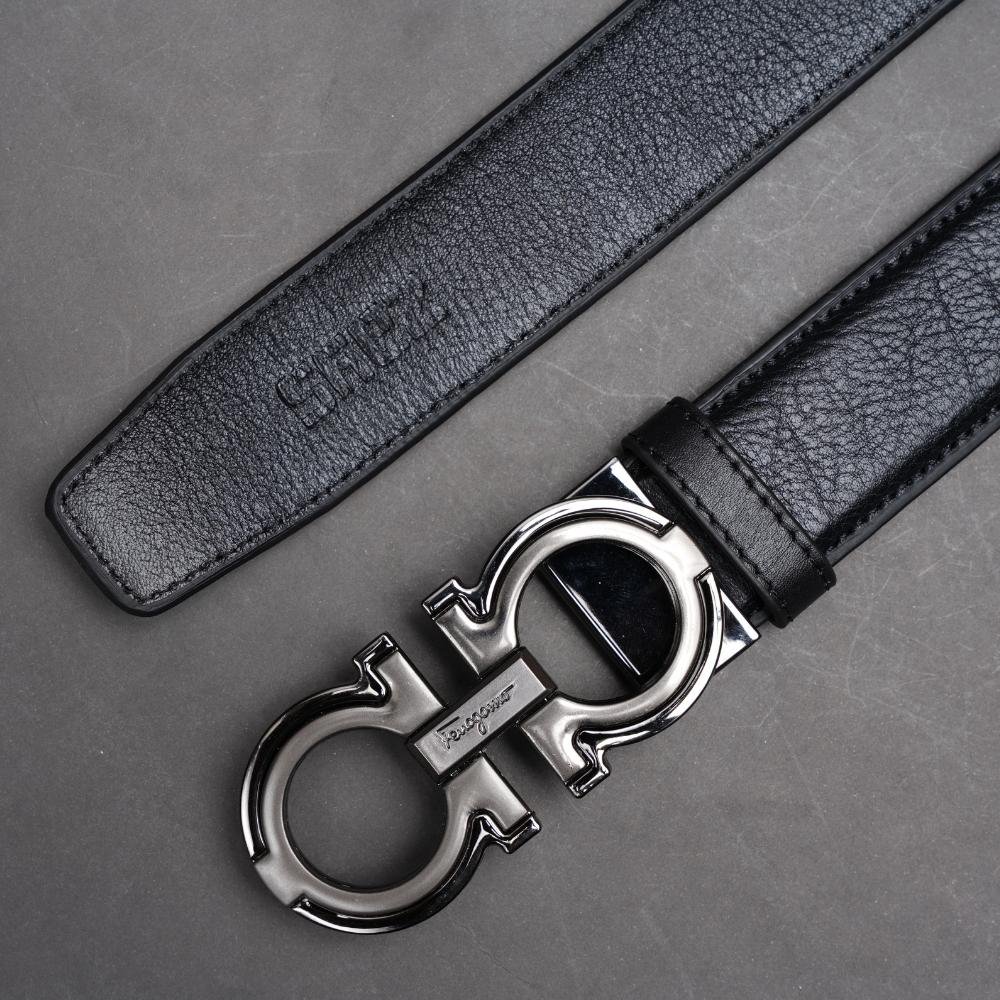 Close view of a Ferragamo belt strap and Gancini buckle showing surface condition.