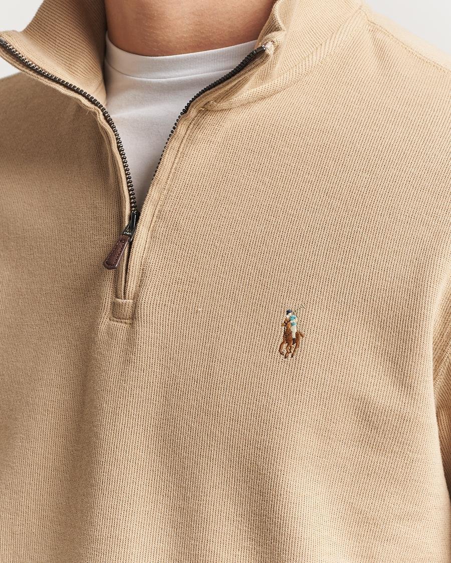Embroidered Pony and zipper details on a Ralph Lauren quarter-zip.