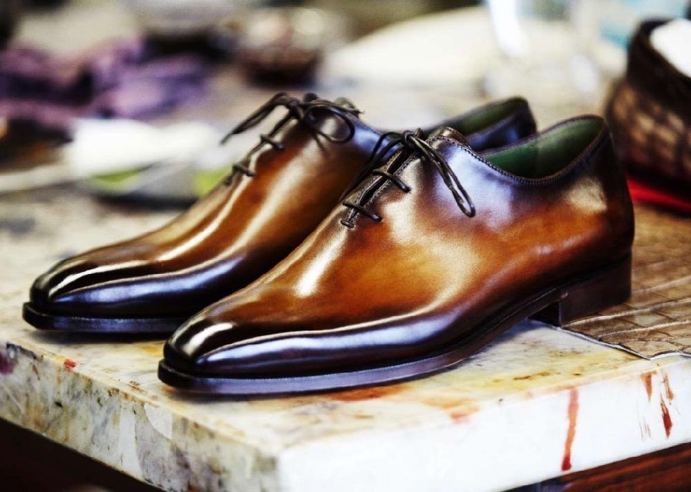 Craftsmanship and patina details on Berluti leather shoes.