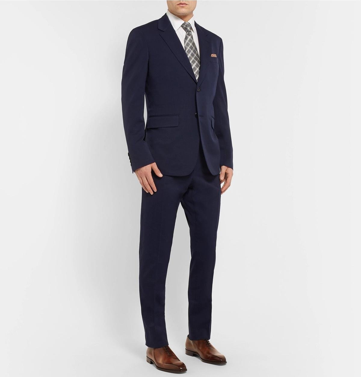 Model wearing Berluti Oxford shoes with tailored clothing.