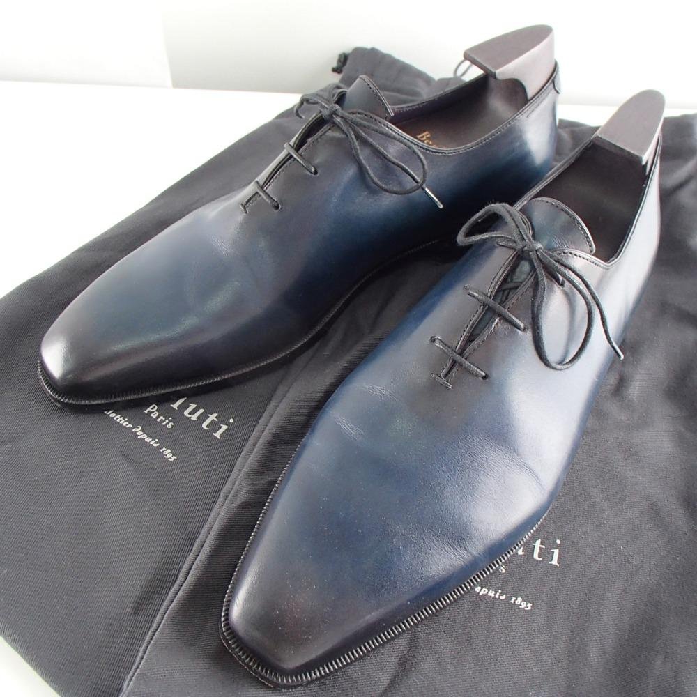 Blue-black Berluti leather Oxford shoes displayed with their dust bags.