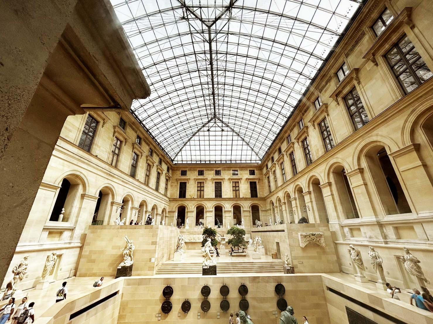 Historic palace architecture inside the Louvre Museum.