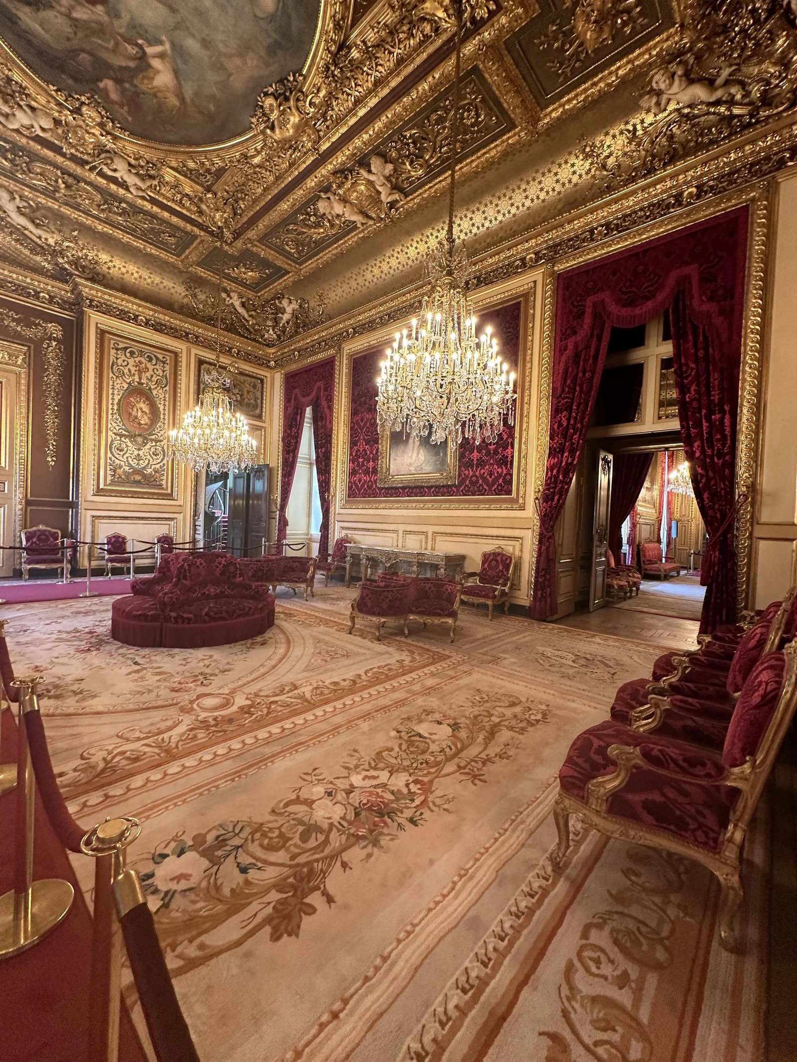 Historic palace interiors and medieval remains at the Louvre.