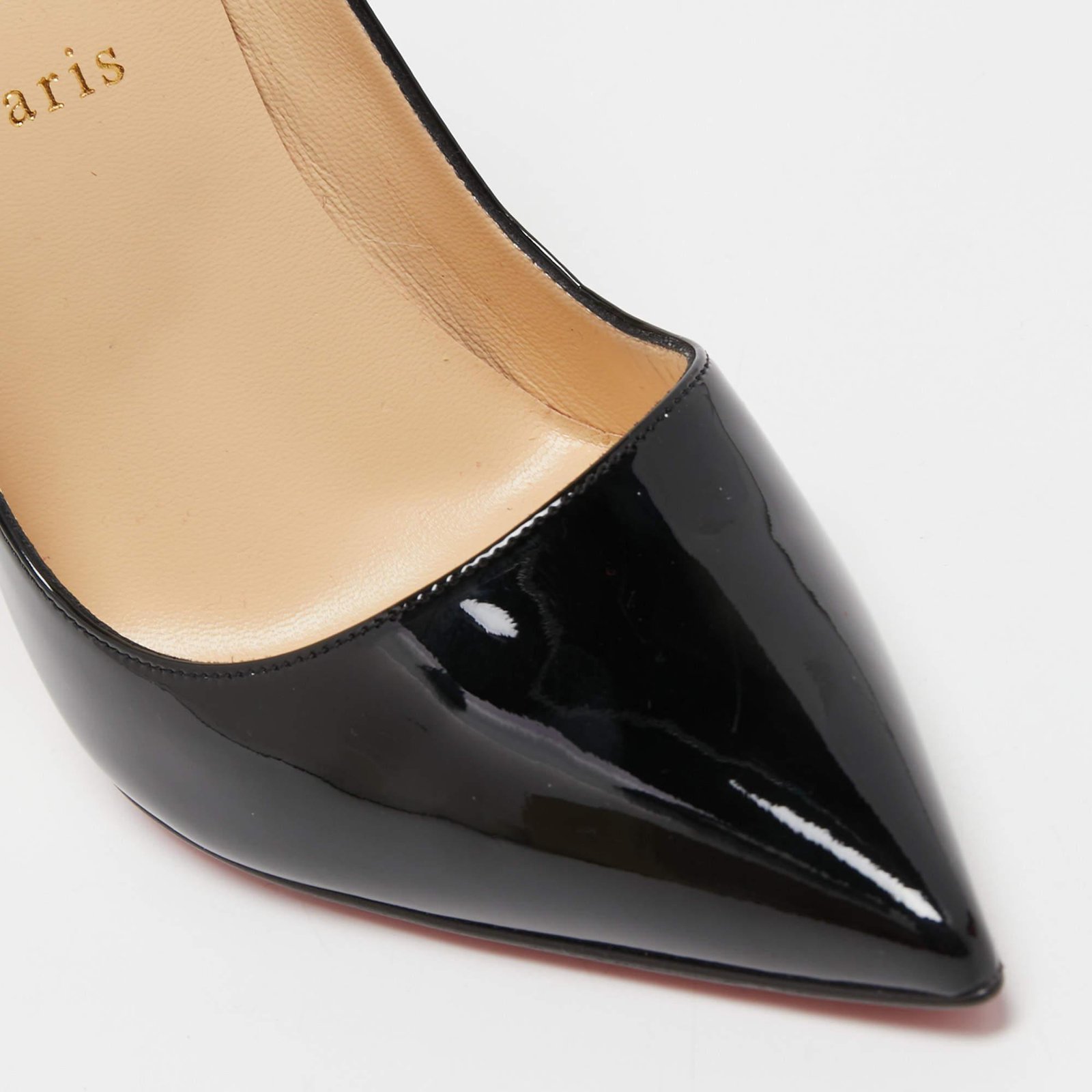 Close-up of the pointed toe and sculpted vamp on a Christian Louboutin So Kate pump.