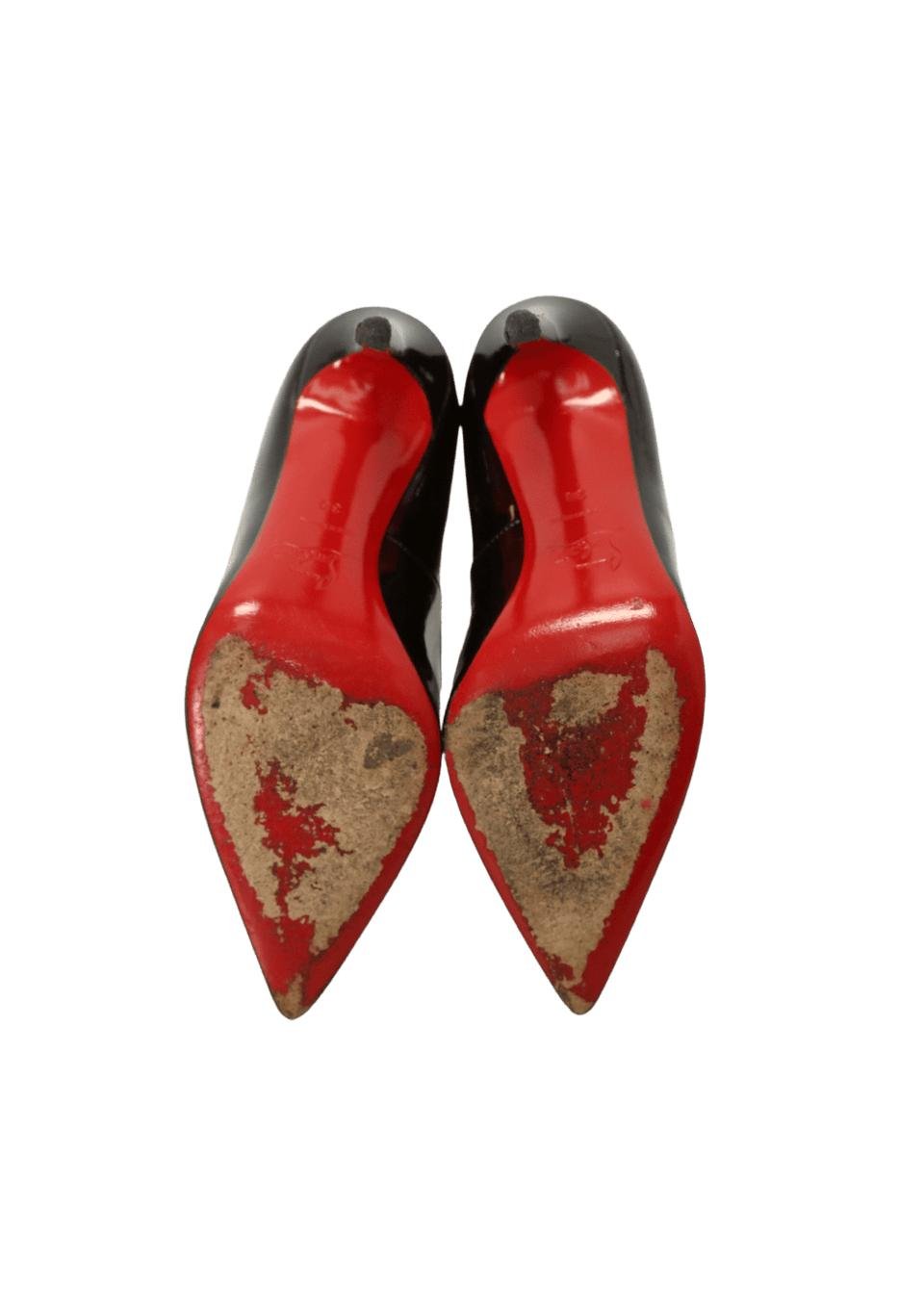 Visible wear on Christian Louboutin red soles and pointed toes.