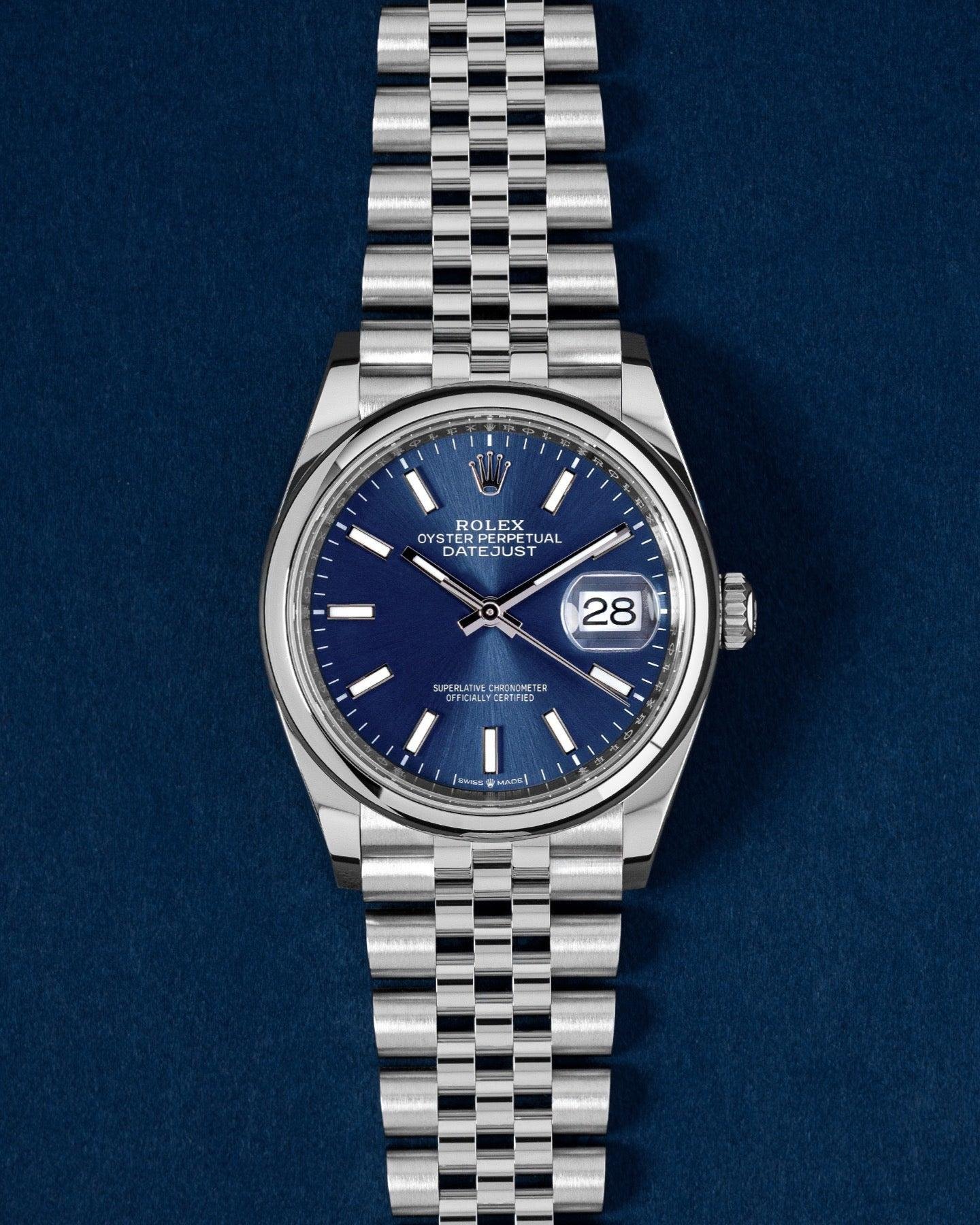 Blue-dial Rolex Datejust with a fluted bezel and five-link Jubilee bracelet.
