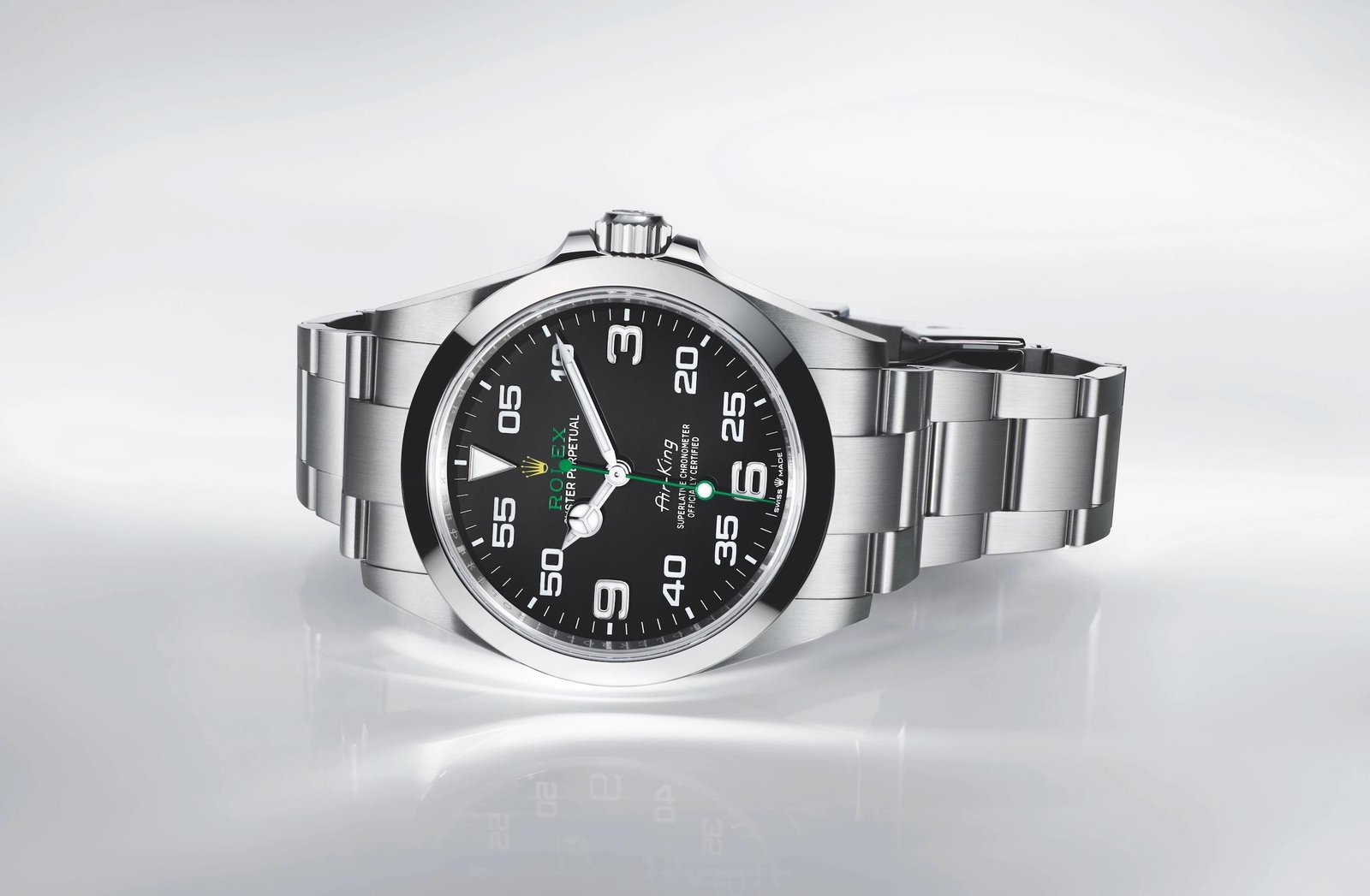 Side view of a steel Rolex watch showing its Oyster case and bracelet.