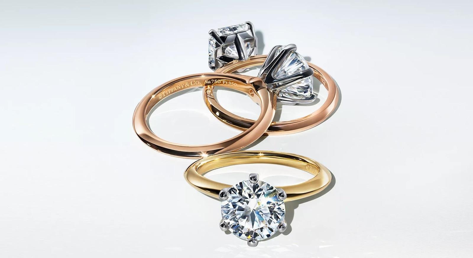 Tiffany engagement rings in different settings and precious-metal finishes.