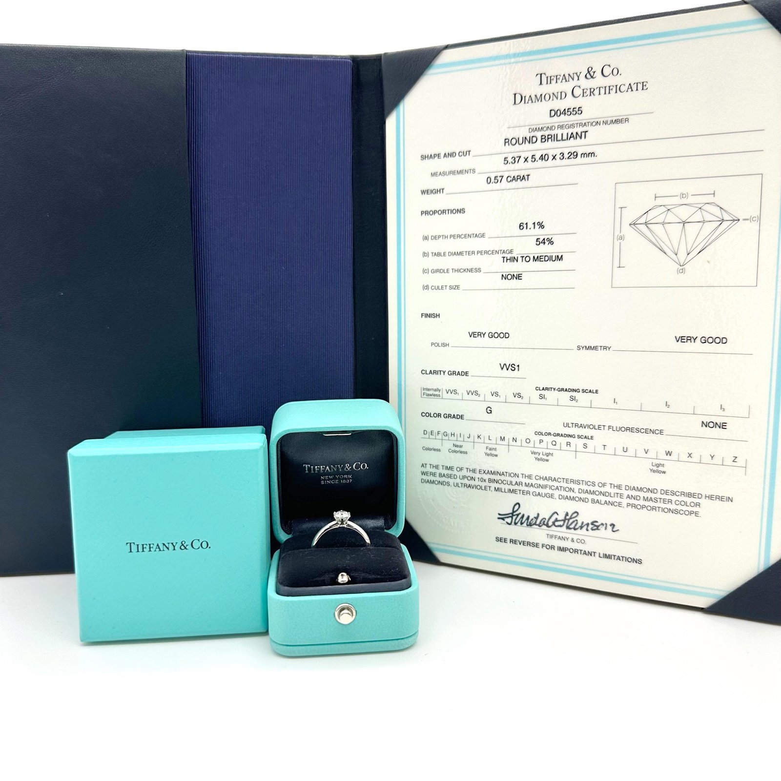 Tiffany engagement ring, Blue Box and diamond certificate presented together.