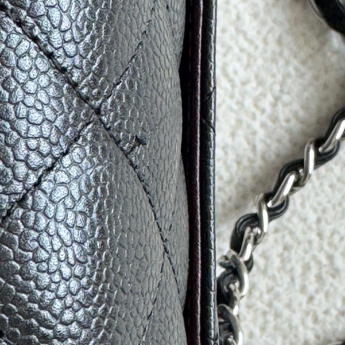 Close-up of edge and chain contact wear on a Chanel Classic Flap.