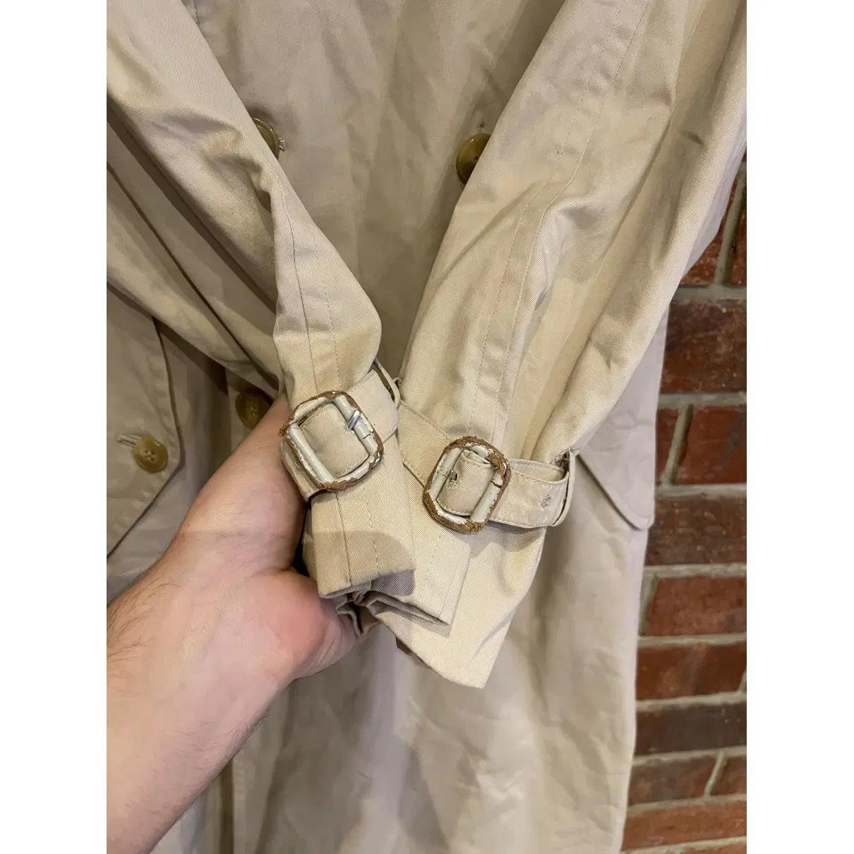 Close-up of worn and adjusted cuff straps on a Burberry trench coat.