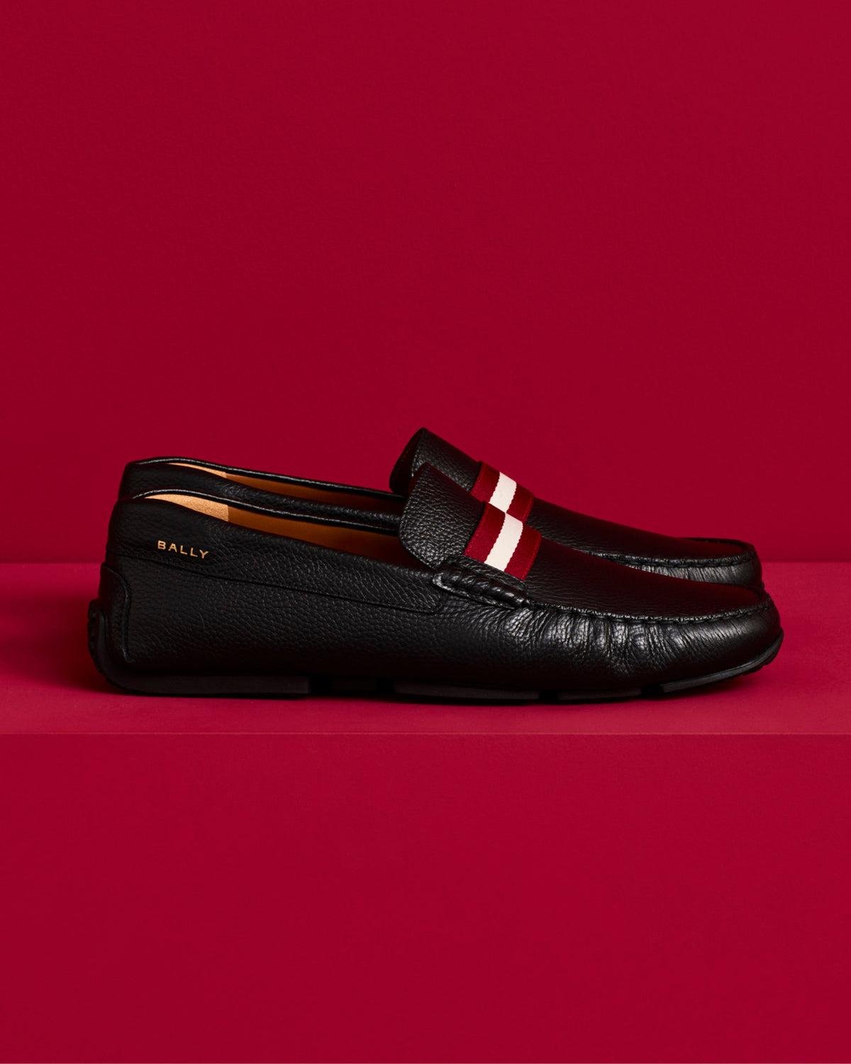 Bally men’s dress shoes, loafers and leather sneakers displayed together.